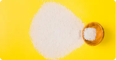 dibutyl tin oxide DBTO catalyst powder in wooden bowl